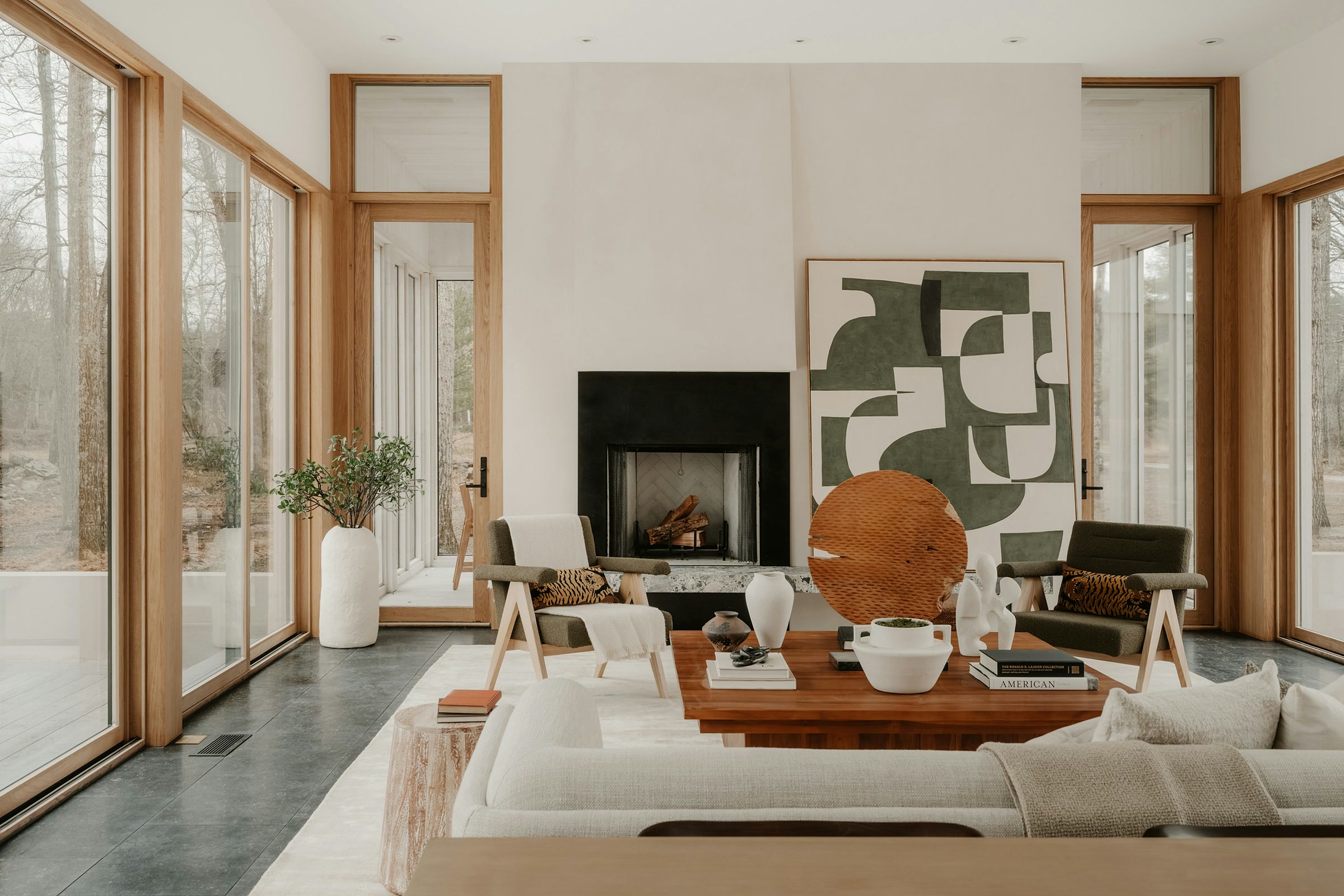 Living room with fireplace and large windows
