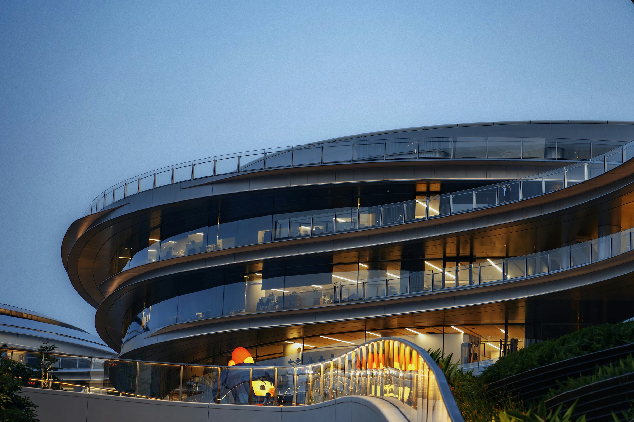 Curved commercial building at dusk